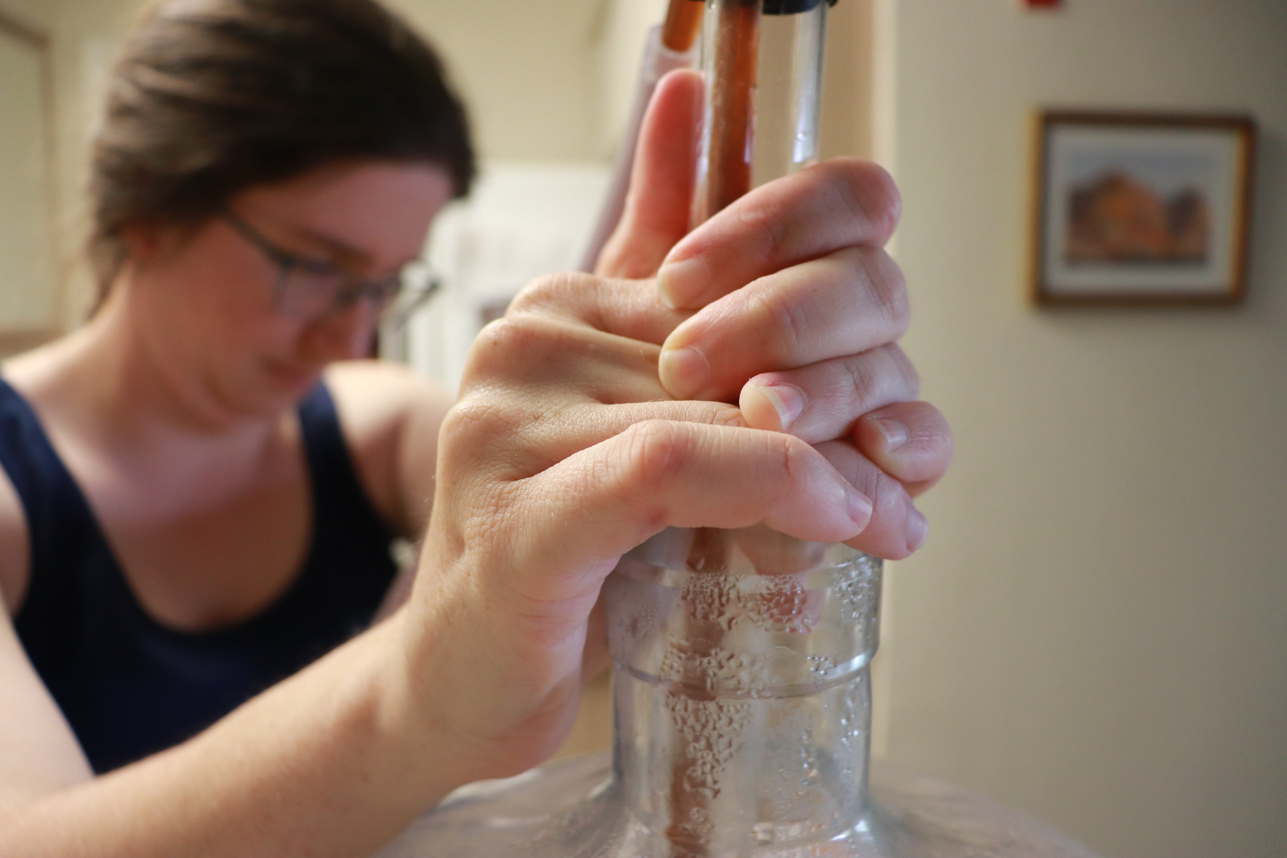 Siphoning beer into a plastic carboy